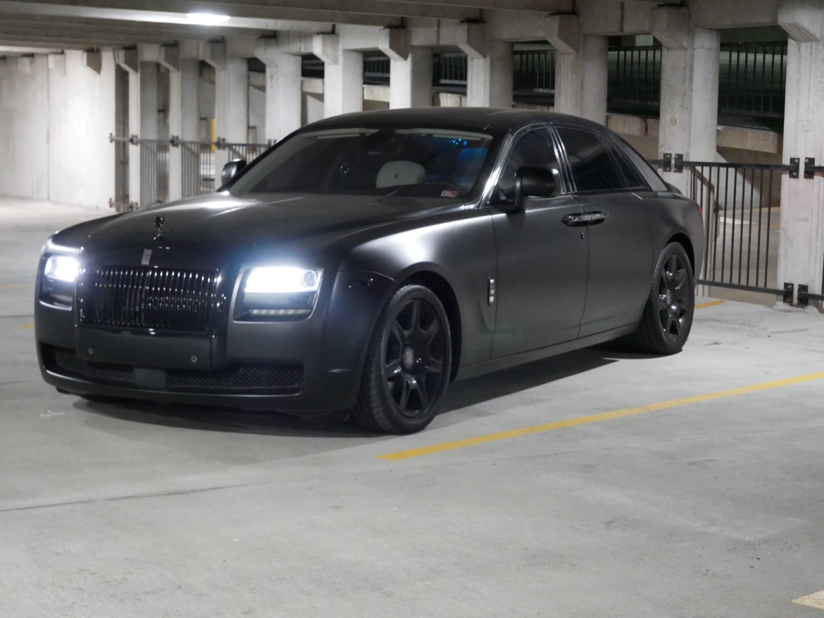 Blacked-out Rolls-Royce Ghost, headlights on