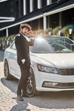 Man with an Luxury Car Rental for Prom Night
