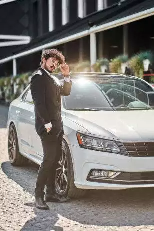 Man with an Luxury Car Rental for Prom Night